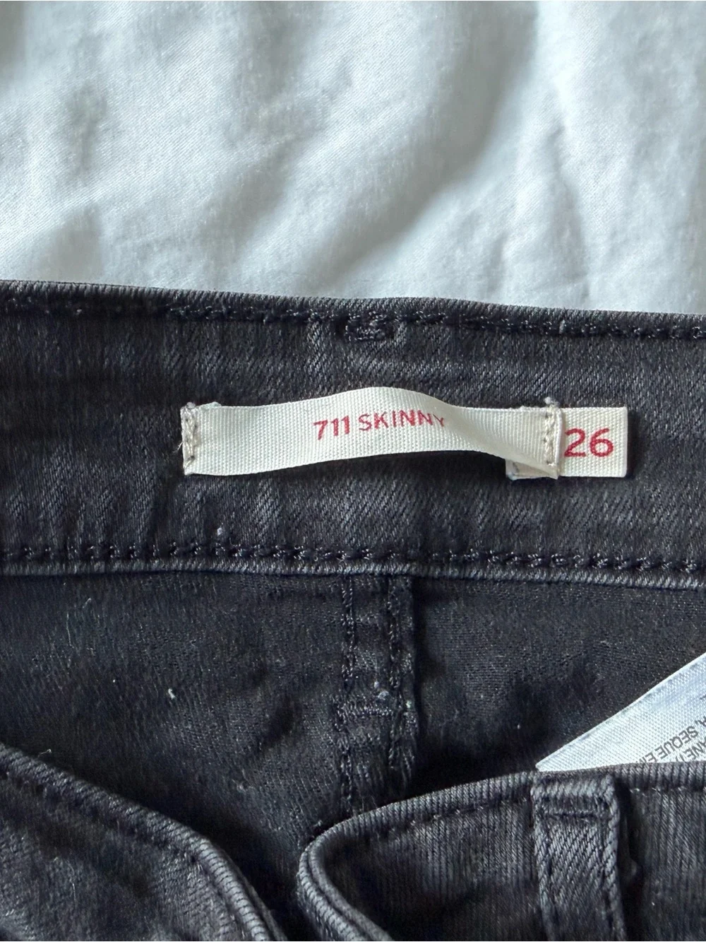 8 pairs of worn Levi black jeans - Size 26